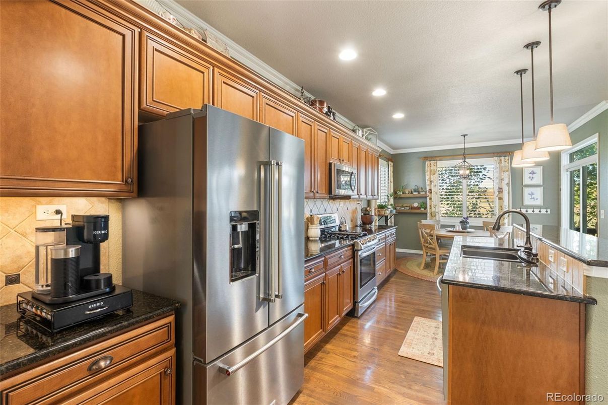Dining room, Interior, Kitchen, Pendant Lights, Recessed Lighting, Stainless Steel Appliances, Wood Texture Flooring