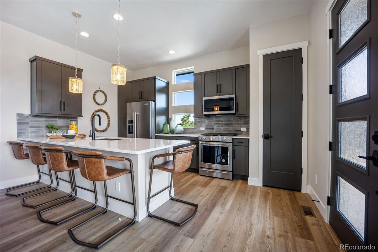 Interior, Kitchen, Pendant Lights, Recessed Lighting, Stainless Steel Appliances, Wood Texture Flooring