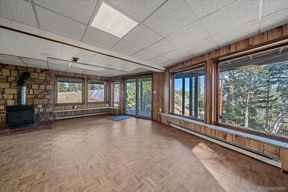 Empty room, Fireplace, Interior, Stone Walls, Sun Room, Wood Texture Flooring