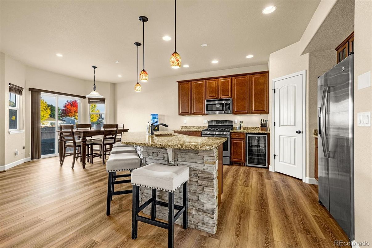 Dining room, Interior, Kitchen, Pendant Lights, Recessed Lighting, Stainless Steel Appliances, Wood Texture Flooring