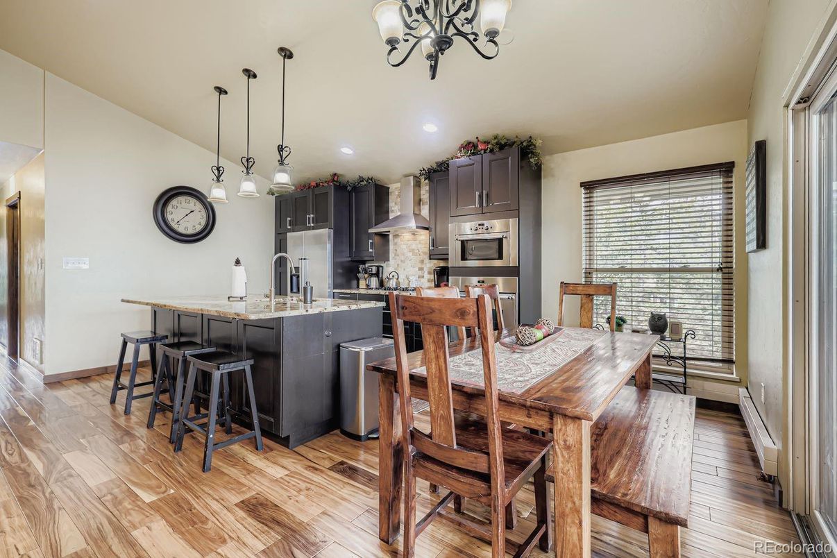 Dining room, Interior, Kitchen, Pendant Lights, Recessed Lighting, Stainless Steel Appliances, Wood Texture Flooring