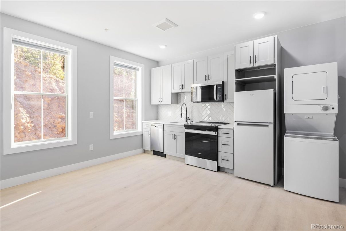 Interior, Kitchen, Recessed Lighting, Washer, Wood Texture Flooring