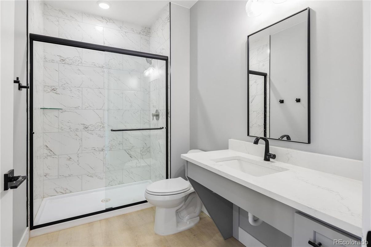 Bathroom, Glass Shower, Interior, Marble Walls, Recessed Lighting, Wood Texture Flooring