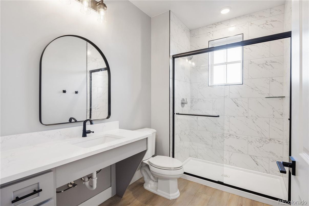 Bathroom, Glass Shower, Interior, Marble Walls, Recessed Lighting, Wood Texture Flooring