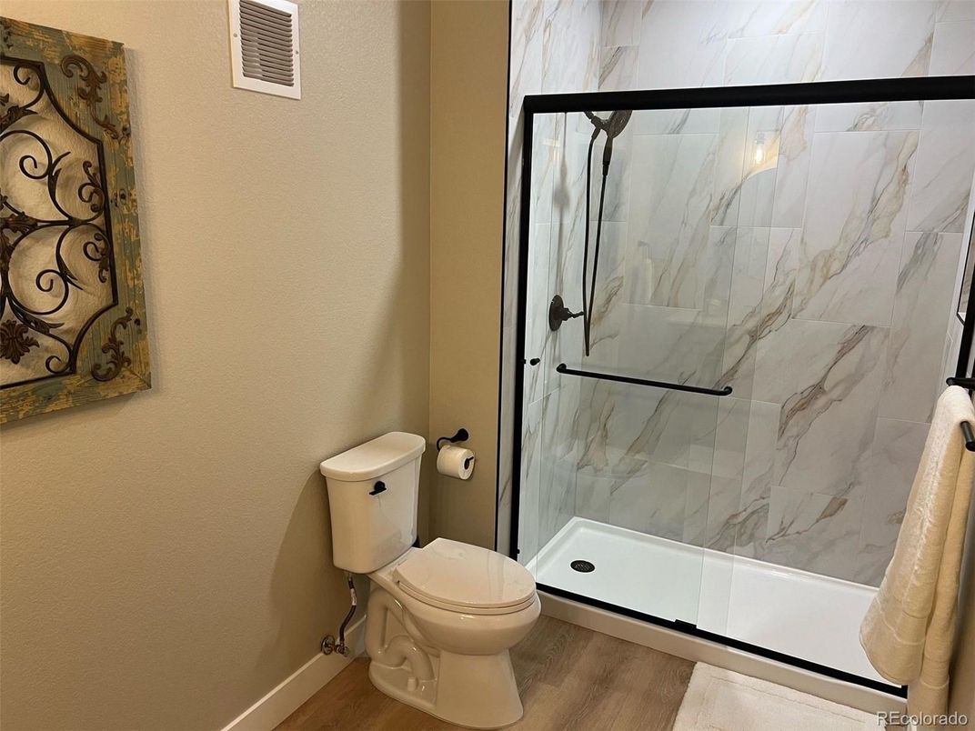 Bathroom, Glass Shower, Interior, Marble Walls, Wood Texture Flooring