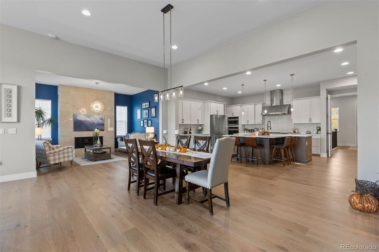 Dining room, Fireplace, Interior, Kitchen, Living room, Pendant Lights, Recessed Lighting, Stainless Steel Appliances, Wood Texture Flooring