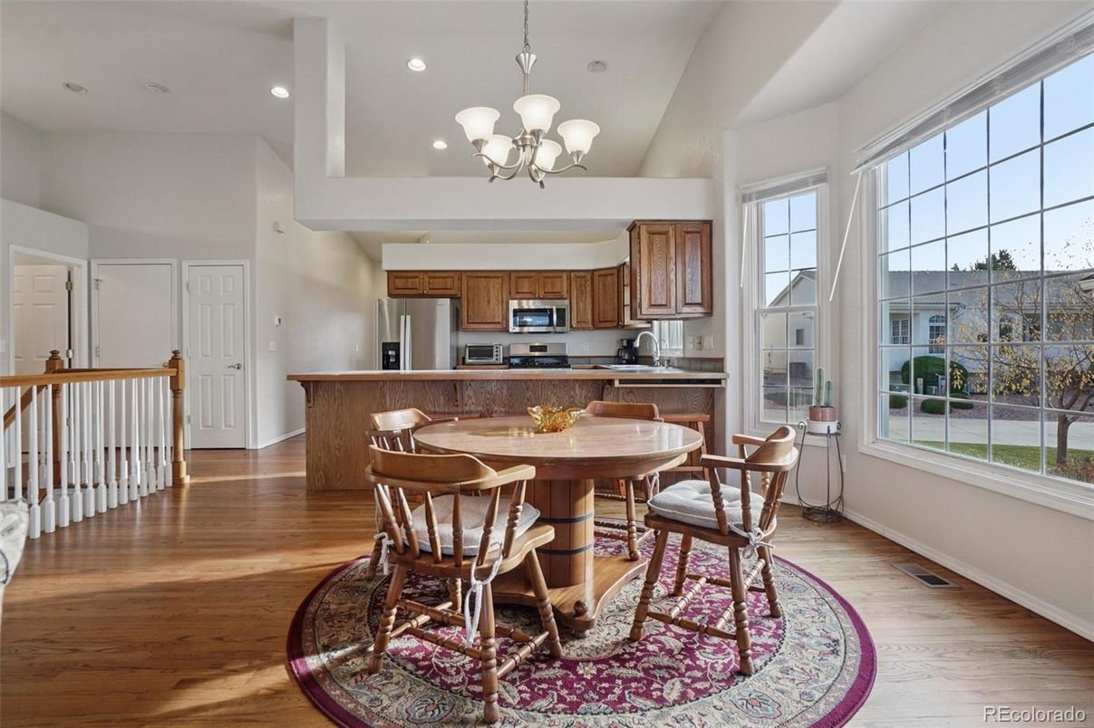 Chandelier, Dining room, Interior, Kitchen, Recessed Lighting, Stainless Steel Appliances, Wood Texture Flooring