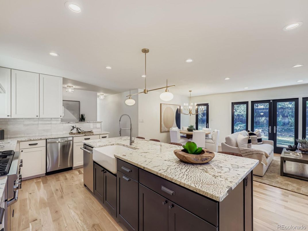 Chandelier, Dining room, Interior, Kitchen, Living room, Pendant Lights, Recessed Lighting, Stainless Steel Appliances, Wood Texture Flooring