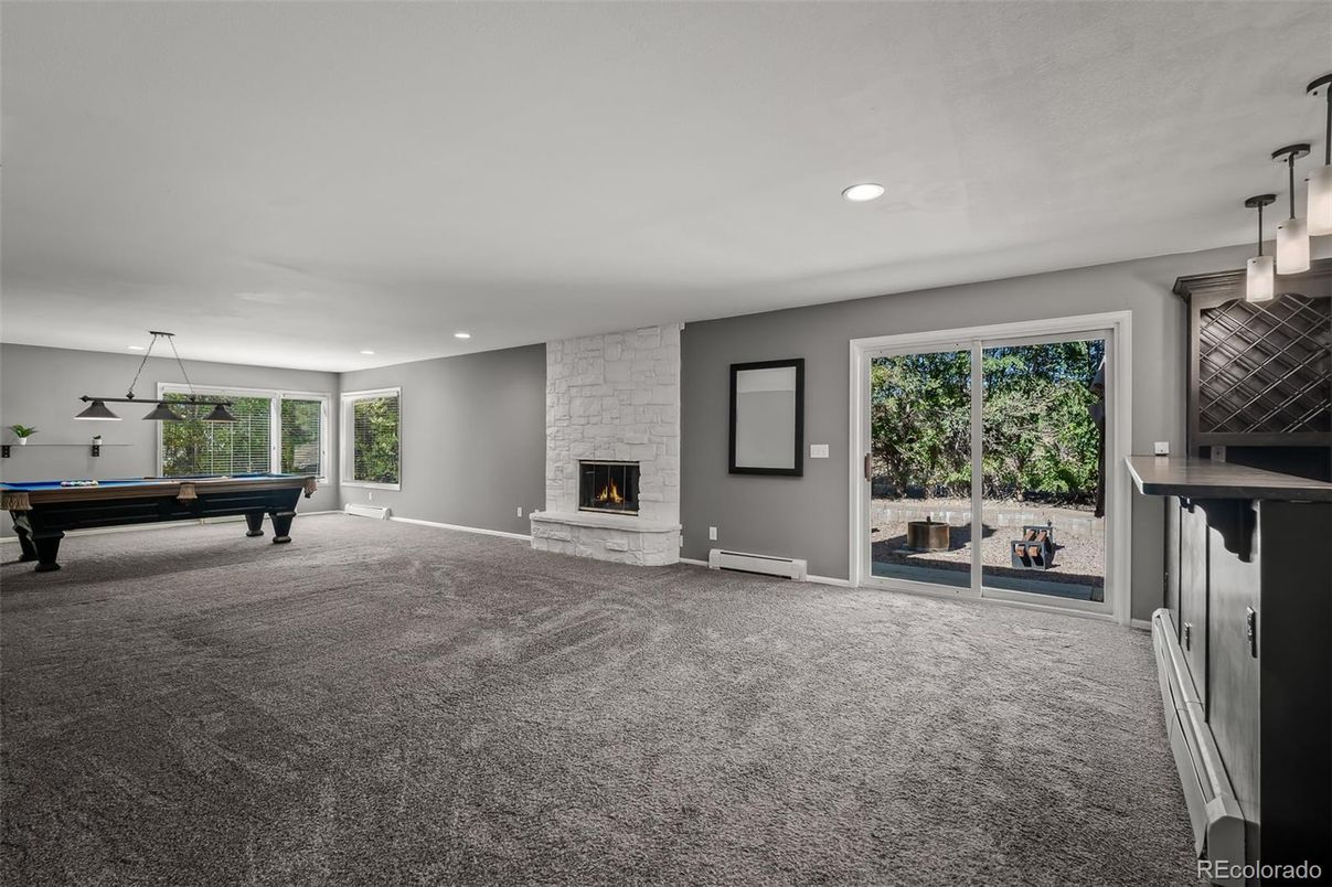 Billiard Table, Empty room, Fireplace, Game Room, Interior, Pendant Lights, Recessed Lighting, Stone Walls