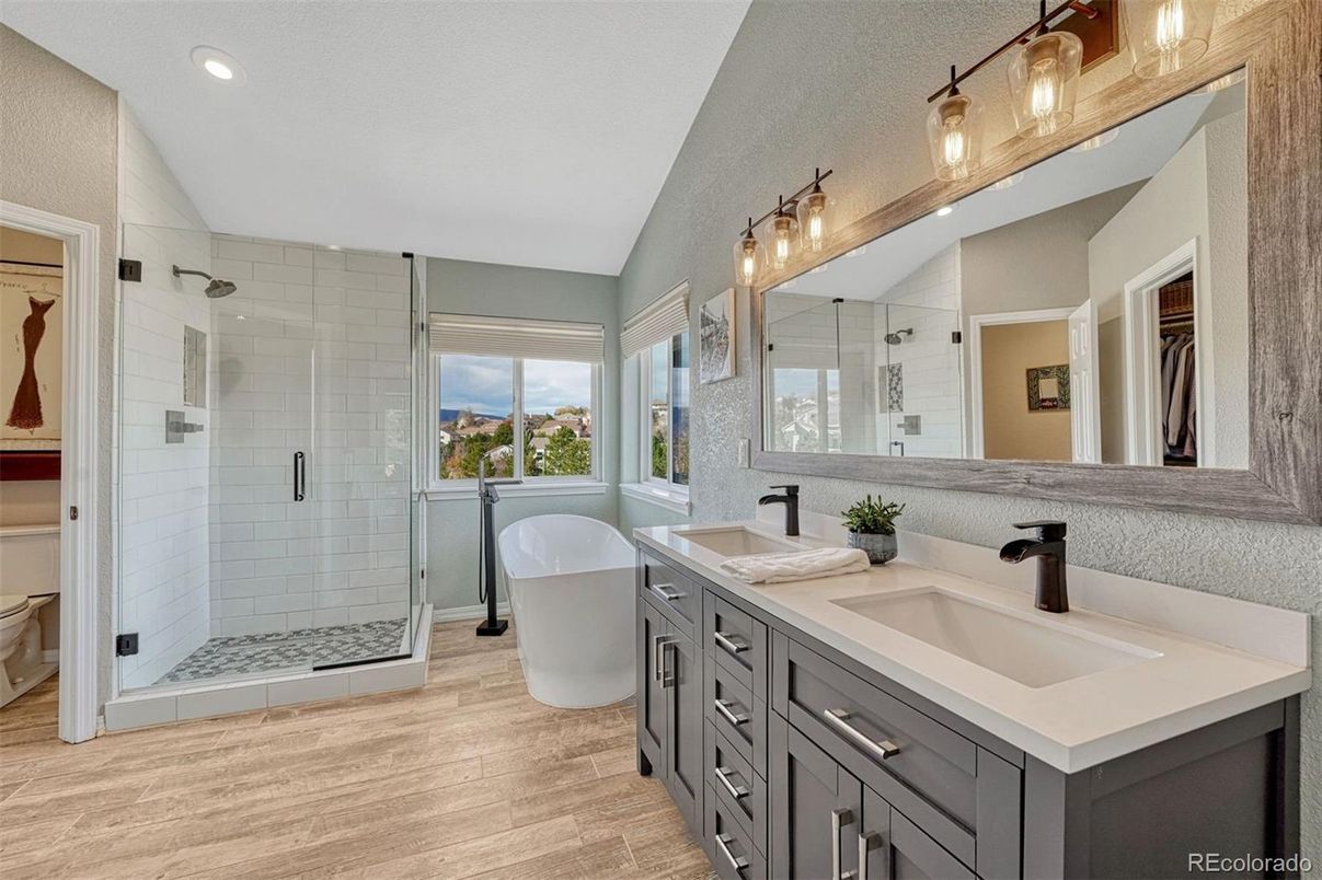 Bathroom, Dual Sink Vanities, Free Standing Baths, Glass Shower, Interior, Recessed Lighting, Wood Texture Flooring