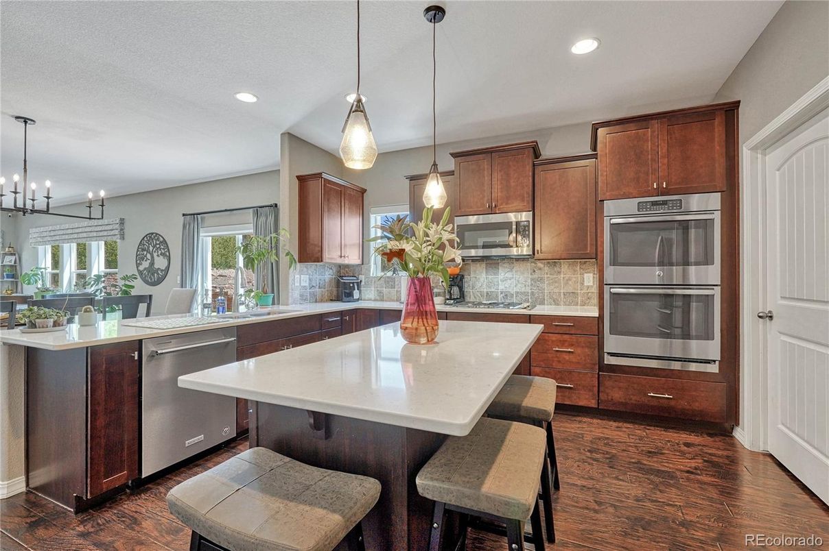 Dining room, Interior, Kitchen, Pendant Lights, Recessed Lighting, Stainless Steel Appliances, Wood Texture Flooring
