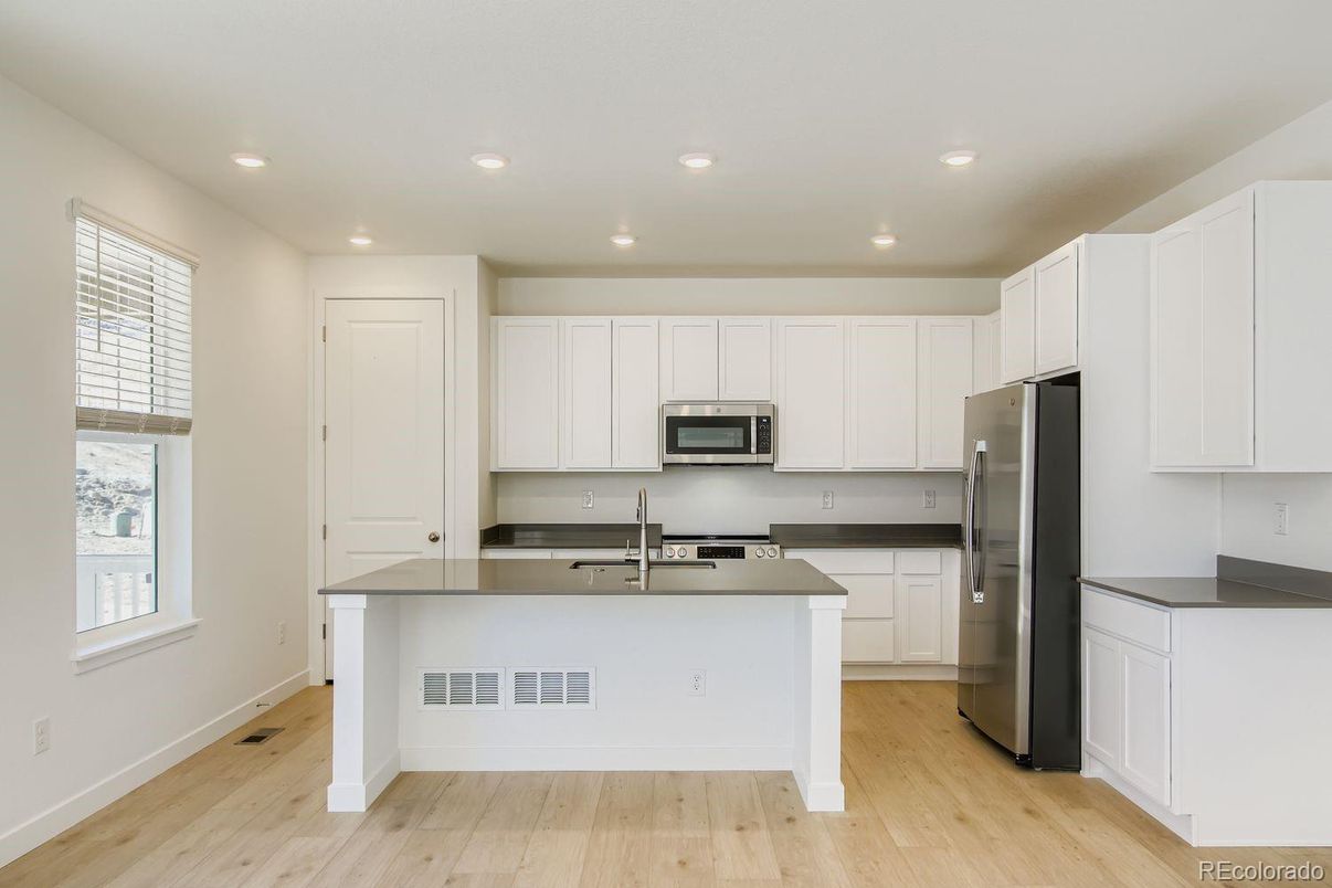 Interior, Kitchen, Recessed Lighting, Stainless Steel Appliances, Wood Texture Flooring