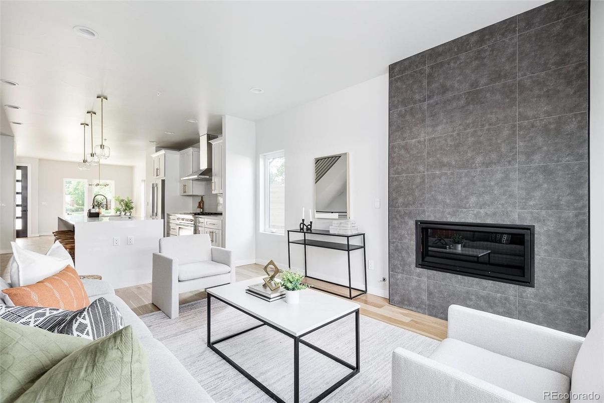 Fireplace, Interior, Kitchen, Living room, Pendant Lights, Recessed Lighting, Stainless Steel Appliances, Wood Texture Flooring