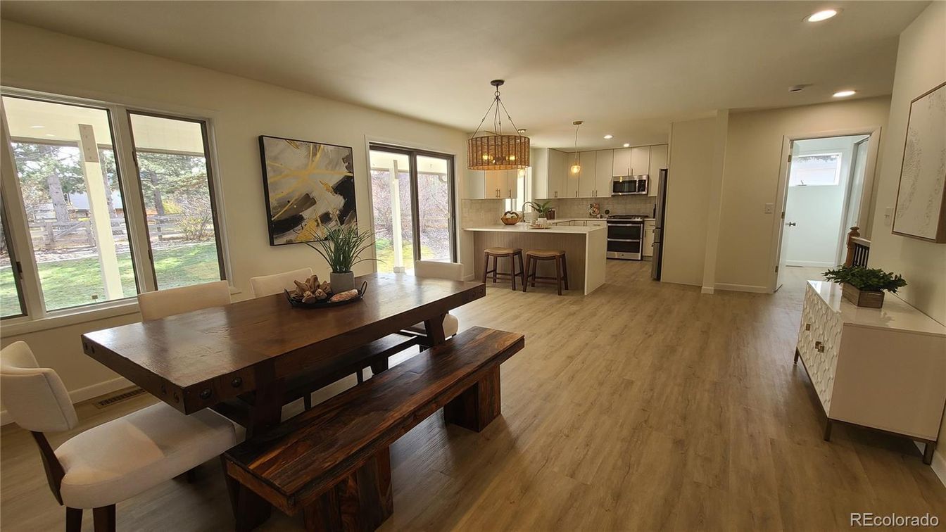 Chandelier, Dining room, Interior, Kitchen, Pendant Lights, Recessed Lighting, Stainless Steel Appliances, Wood Texture Flooring