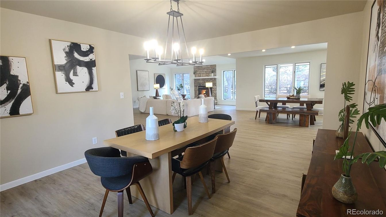 Chandelier, Dining room, Fireplace, Interior, Living room, Pendant Lights, Recessed Lighting, Wood Texture Flooring