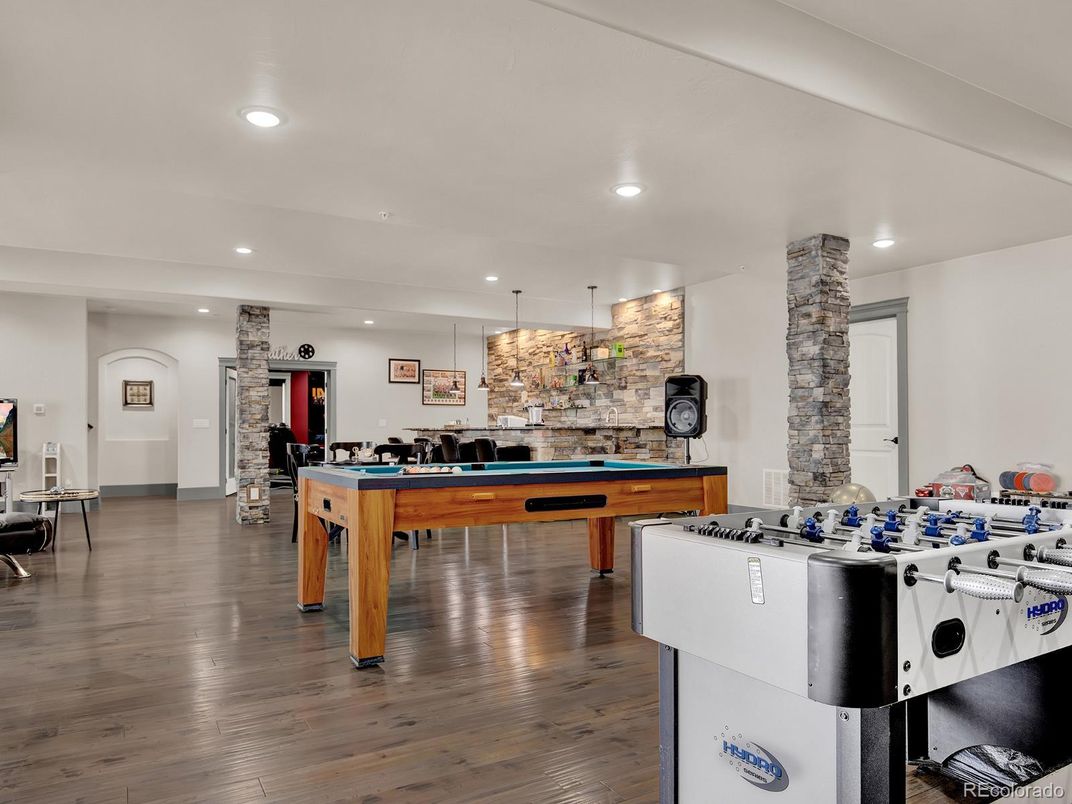 Billiard Table, Game Room, Interior, Pendant Lights, Recessed Lighting, Stone Walls, Wood Texture Flooring