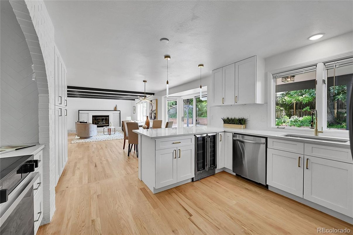 Dining room, Fireplace, Interior, Kitchen, Pendant Lights, Recessed Lighting, Stainless Steel Appliances, Wood Texture Flooring