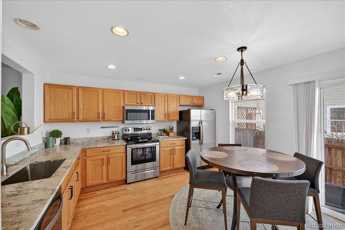 Dining room, Interior, Kitchen, Pendant Lights, Recessed Lighting, Stainless Steel Appliances, Wood Texture Flooring