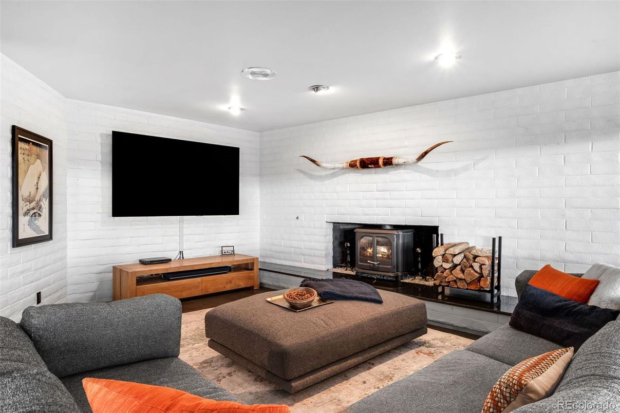 Fireplace, Interior, Living room, Recessed Lighting, Stone Walls, Wood Texture Flooring