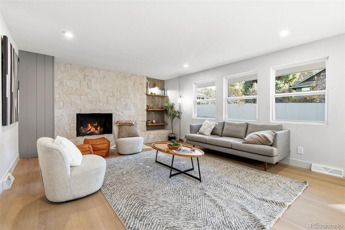 Fireplace, Interior, Living room, Recessed Lighting, Stone Walls, Wood Texture Flooring