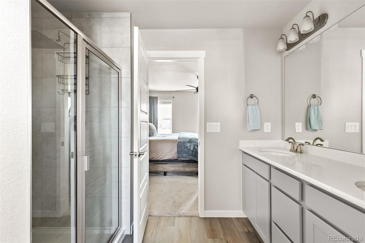 Bathroom, Bedroom, Dual Sink Vanities, Glass Shower, Interior, Wood Texture Flooring