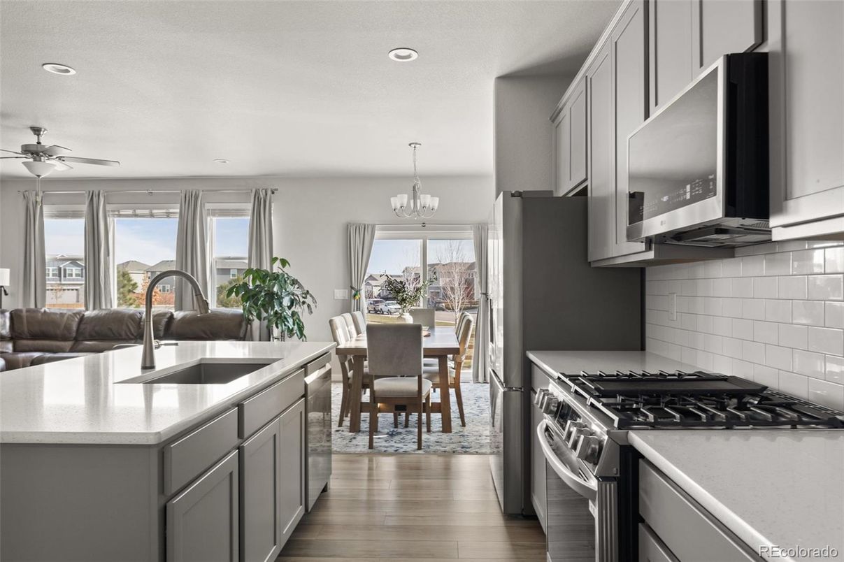 Chandelier, Dining room, Interior, Kitchen, Recessed Lighting, Stainless Steel Appliances, Wood Texture Flooring