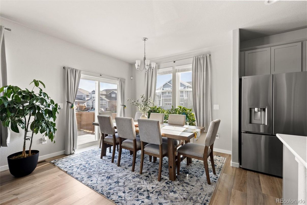 Chandelier, Dining room, Interior, Kitchen, Stainless Steel Appliances, Wood Texture Flooring