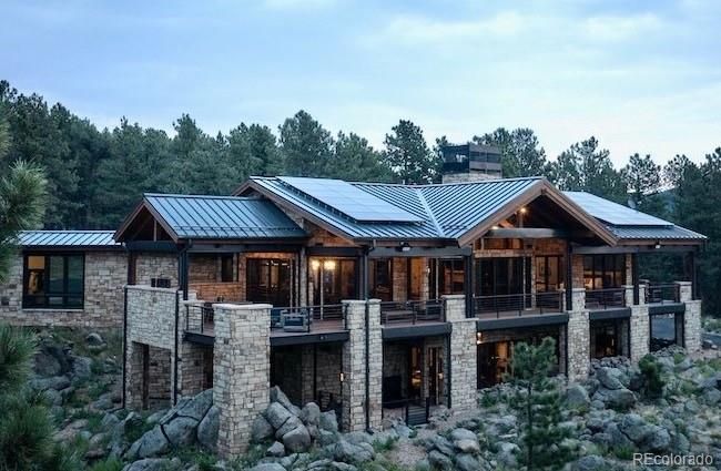 Exterior, Facade, Brick Facade, Solar Panels, Log Home