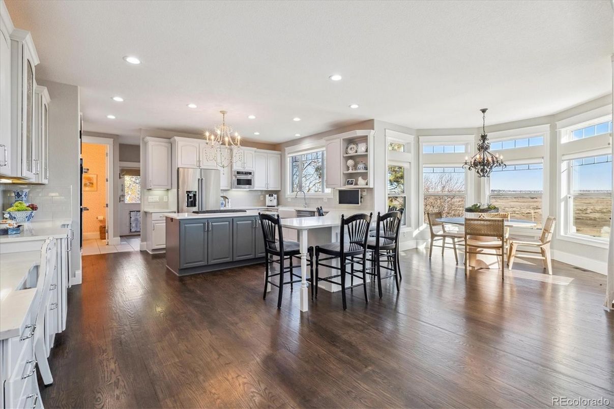 Chandelier, Dining room, Interior, Kitchen, Recessed Lighting, Stainless Steel Appliances, Wood Texture Flooring