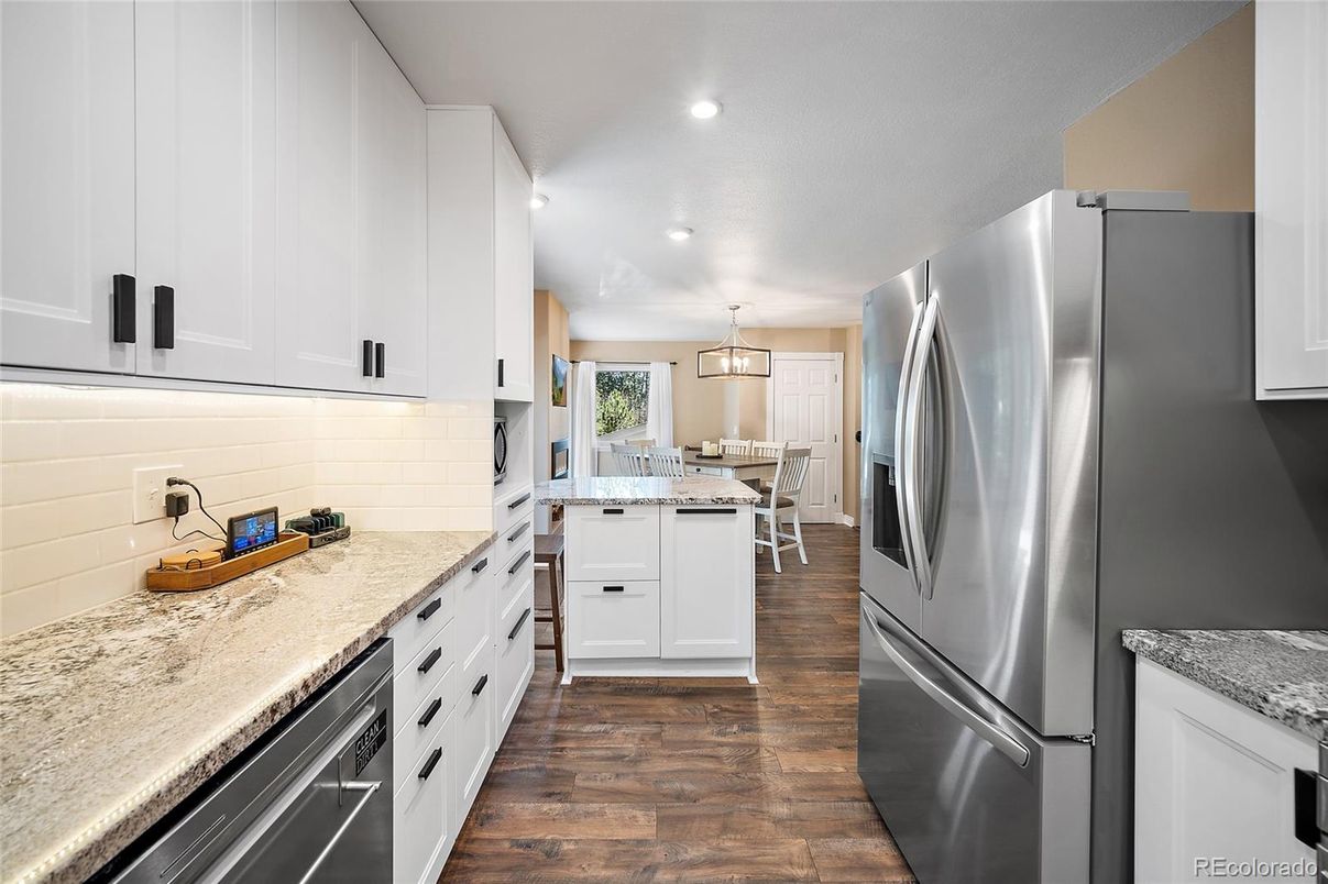 Dining room, Interior, Kitchen, Pendant Lights, Recessed Lighting, Stainless Steel Appliances, Wood Texture Flooring
