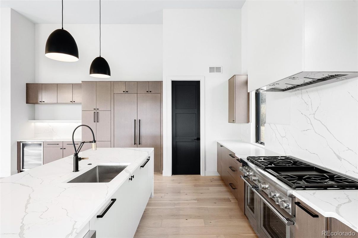 Interior, Kitchen, Marble Walls, Pendant Lights, Stainless Steel Appliances, Wood Texture Flooring