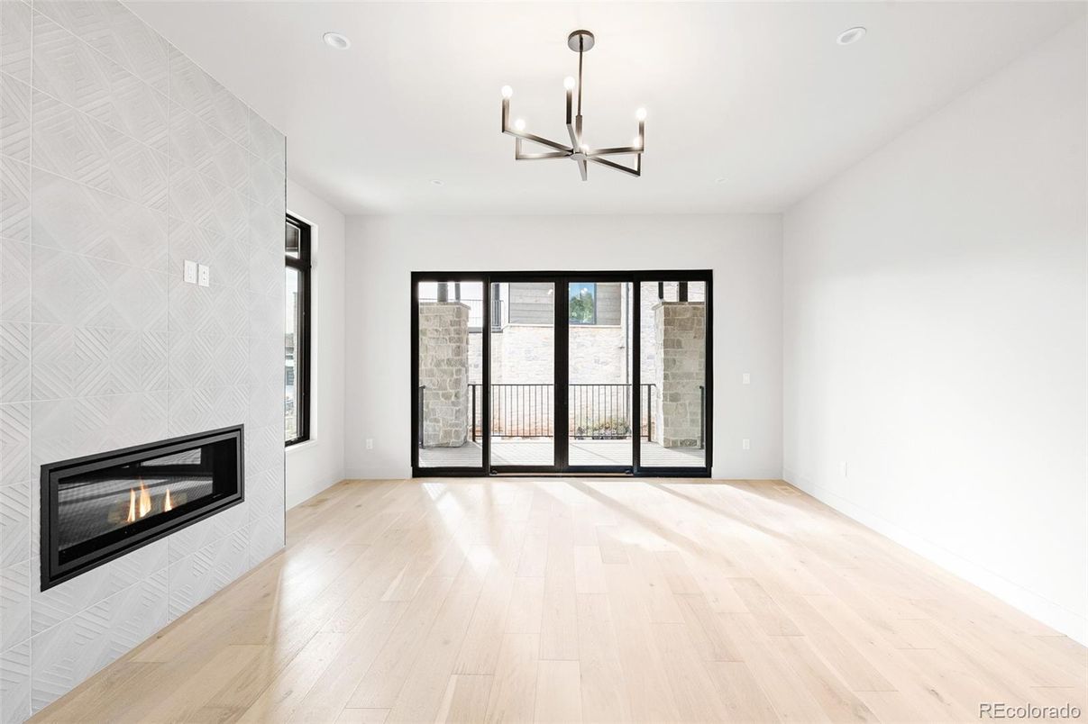 Chandelier, Empty room, Fireplace, Interior, Recessed Lighting, Wood Texture Flooring