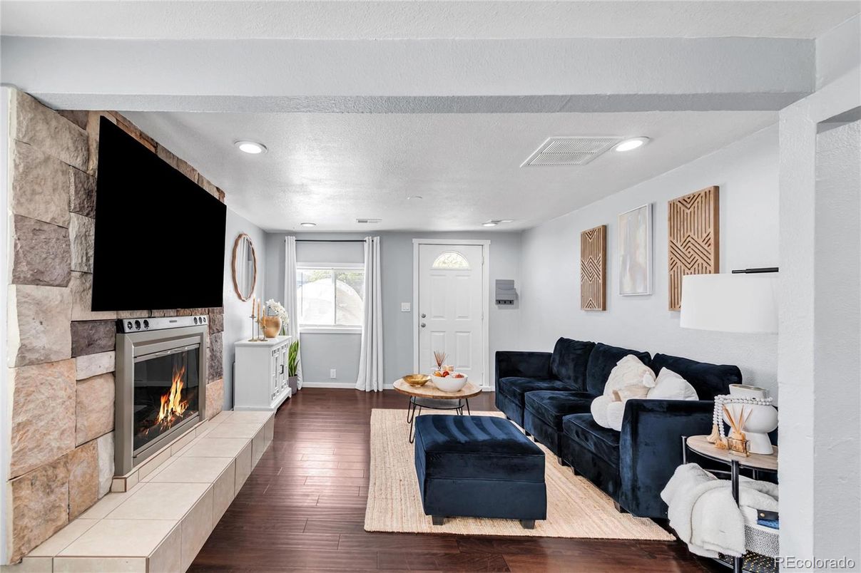 Fireplace, Interior, Living room, Recessed Lighting, Stone Walls, Wood Texture Flooring