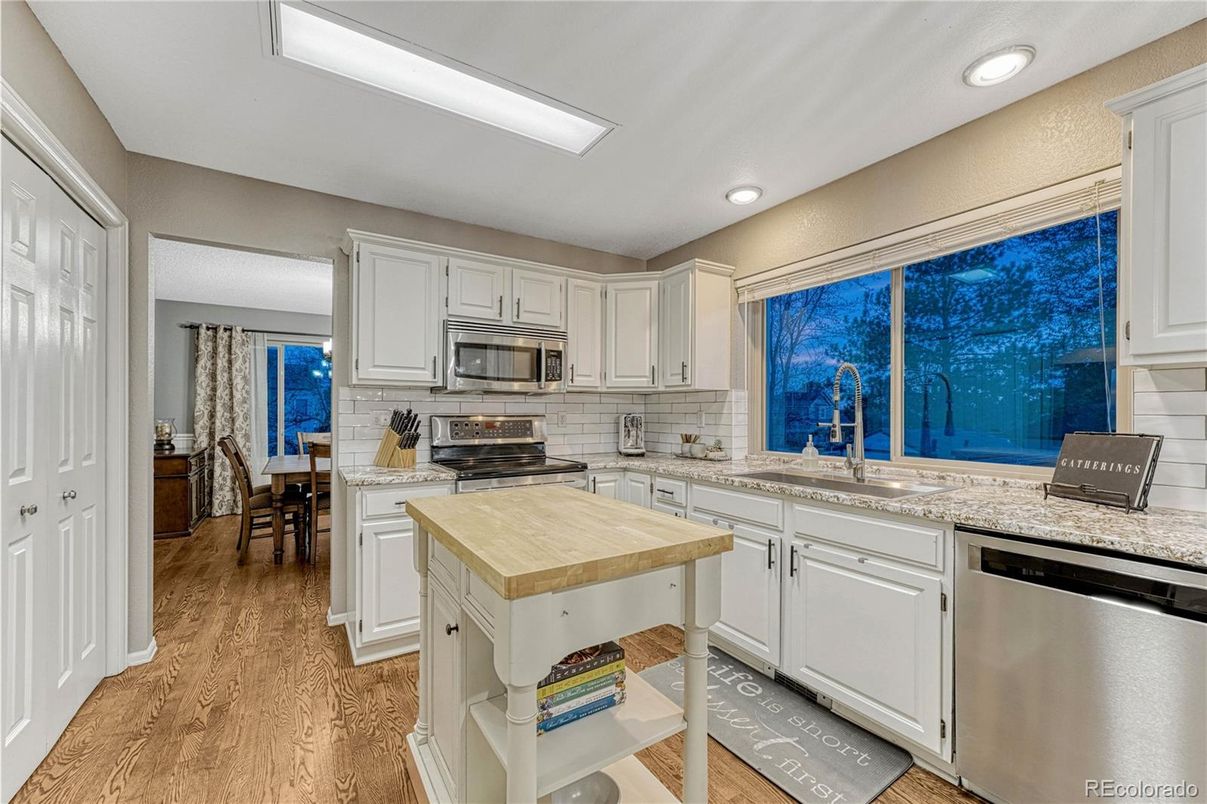 Dining room, Interior, Kitchen, Recessed Lighting, Stainless Steel Appliances, Wood Texture Flooring