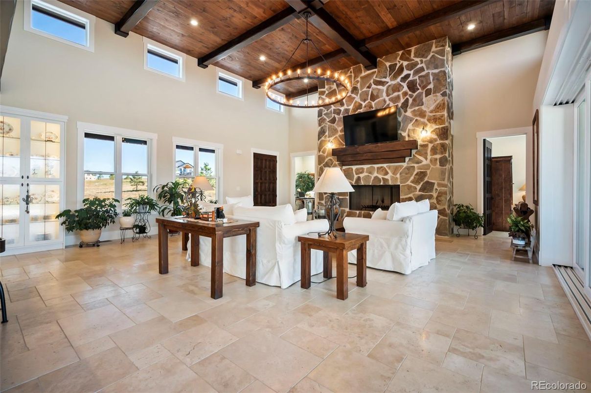 Chandelier, Fireplace, Interior, Living room, Pendant Lights, Recessed Lighting, Wooden Beams, Wooden Ceilings