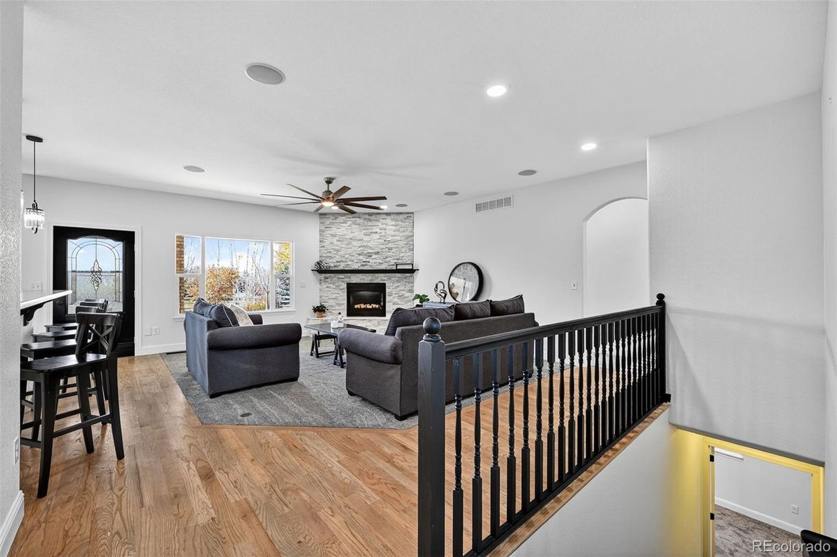 Fireplace, Interior, Living room, Pendant Lights, Recessed Lighting, Stone Walls, Wood Texture Flooring