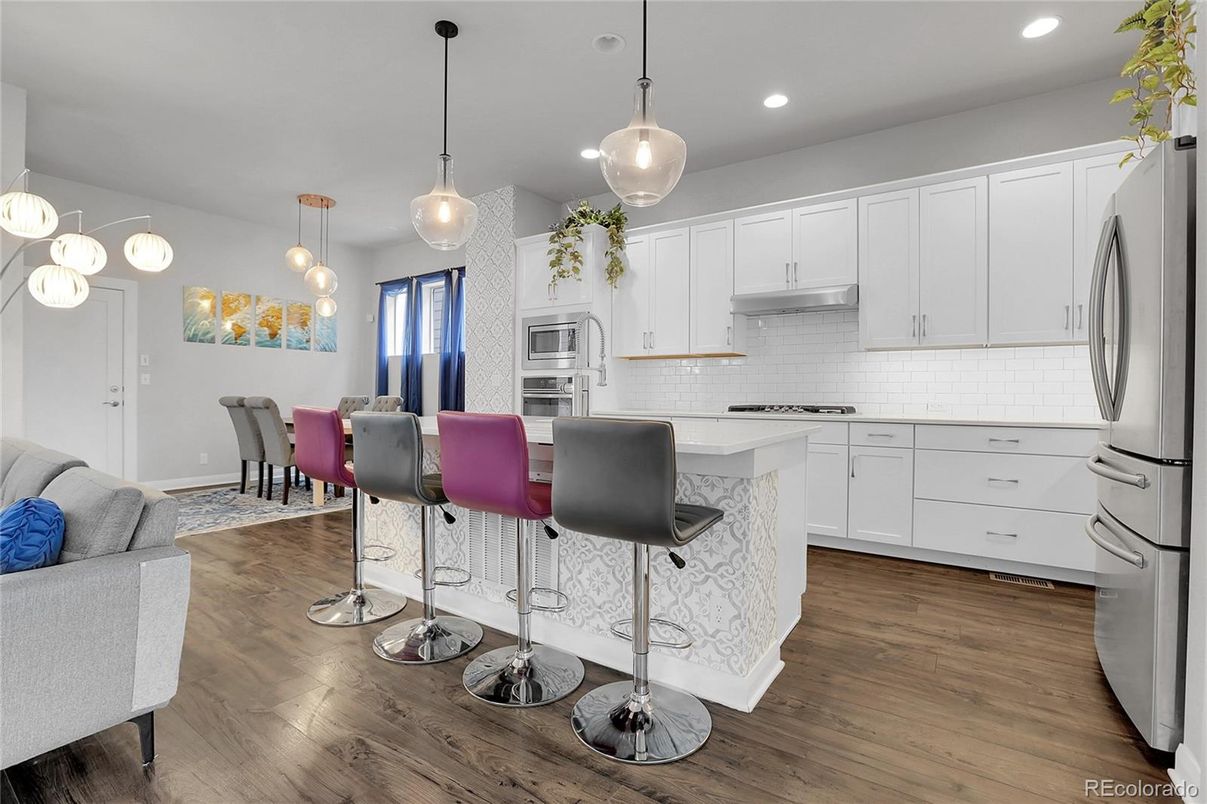 Dining room, Interior, Kitchen, Pendant Lights, Recessed Lighting, Stainless Steel Appliances, Wood Texture Flooring
