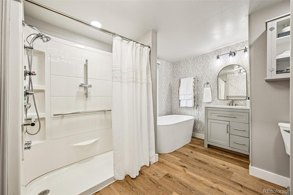 Bathroom, Dual Sink Vanities, Free Standing Baths, Interior, Recessed Lighting, Wood Texture Flooring