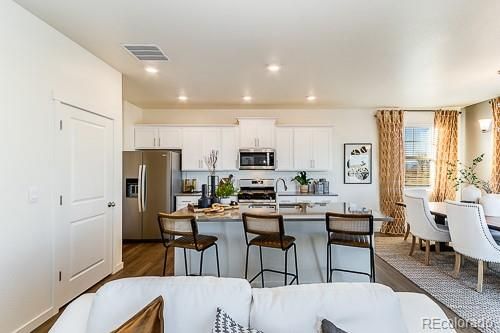 Dining room, Interior, Kitchen, Recessed Lighting, Stainless Steel Appliances, Wood Texture Flooring
