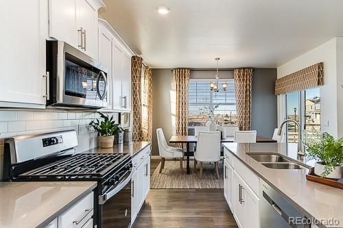 Chandelier, Dining room, Interior, Kitchen, Pendant Lights, Recessed Lighting, Stainless Steel Appliances, Wood Texture Flooring