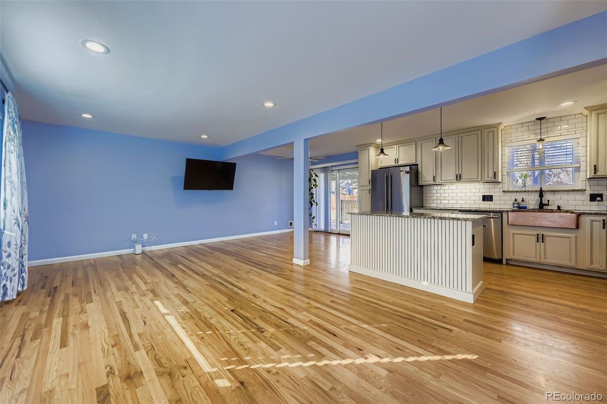 Empty room, Interior, Kitchen, Pendant Lights, Recessed Lighting, Stainless Steel Appliances, Wood Texture Flooring