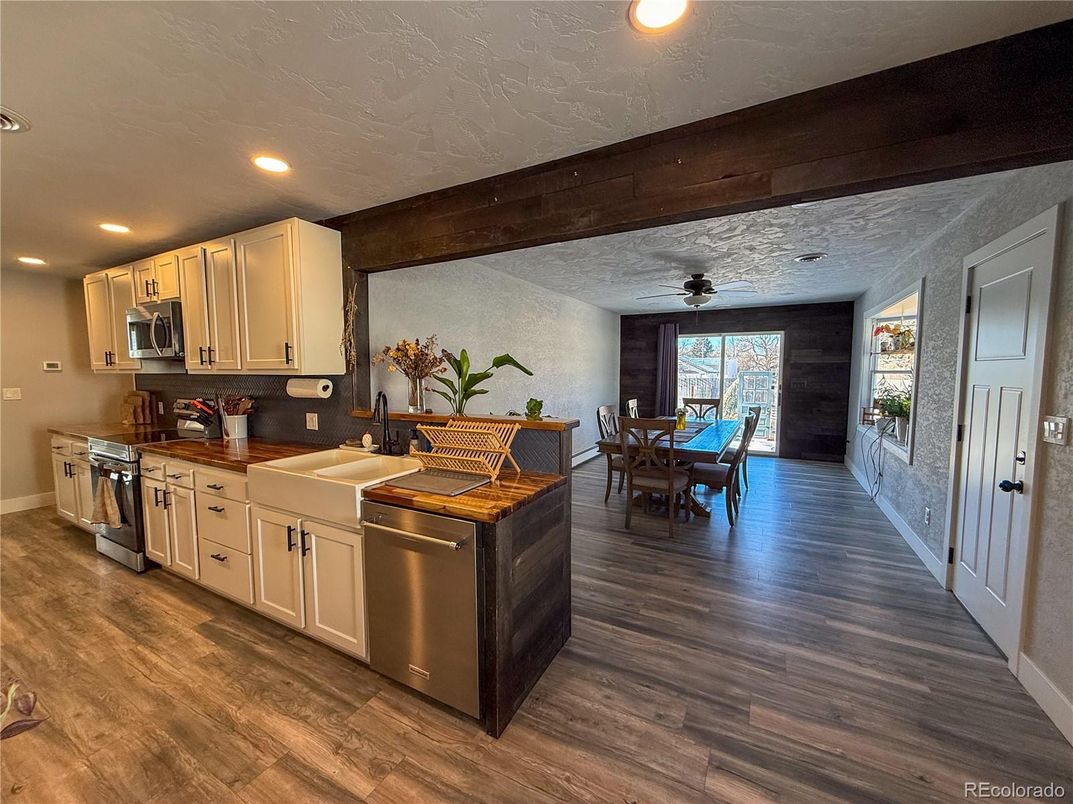 Dining room, Interior, Kitchen, Recessed Lighting, Stainless Steel Appliances, Wood Texture Flooring