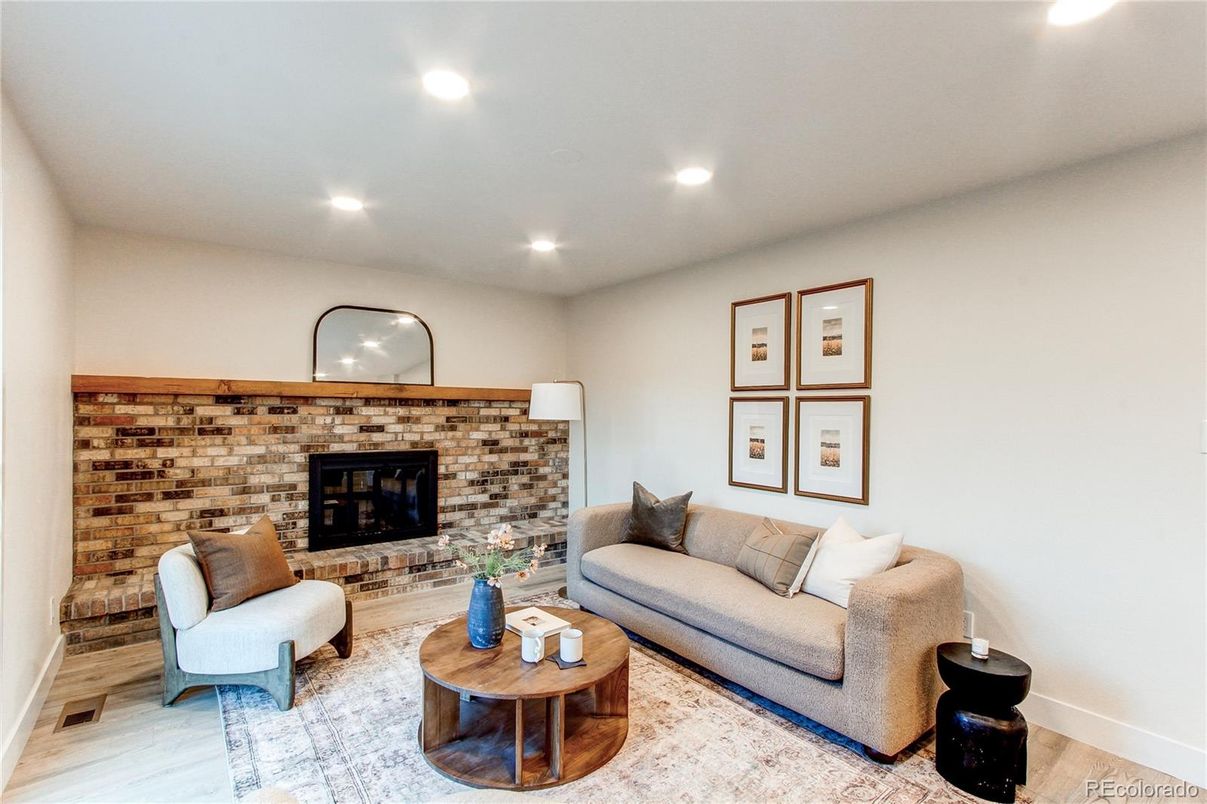 Fireplace, Interior, Living room, Recessed Lighting, Stone Walls, Wood Texture Flooring