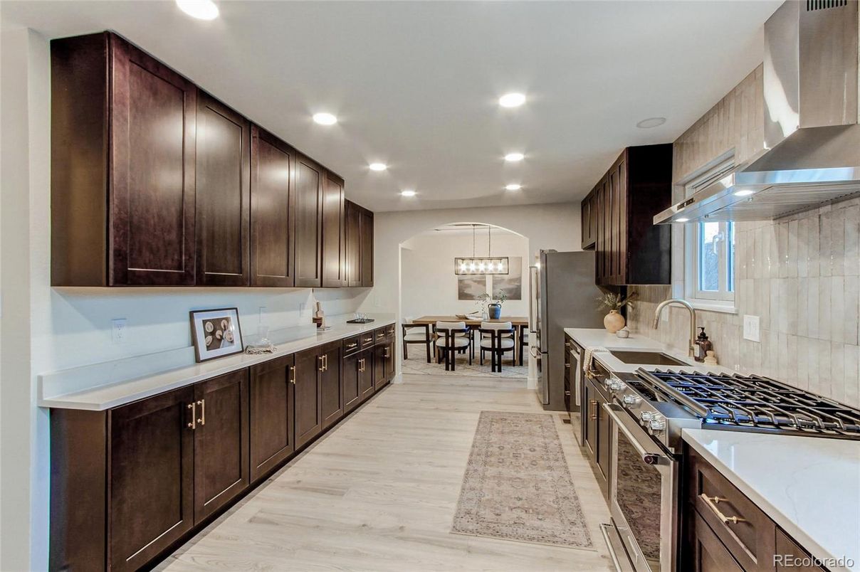 Chandelier, Dining room, Interior, Kitchen, Pendant Lights, Recessed Lighting, Stainless Steel Appliances, Wood Texture Flooring