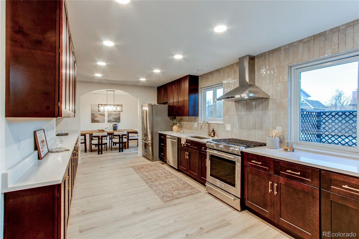 Dining room, Interior, Kitchen, Pendant Lights, Recessed Lighting, Stainless Steel Appliances, Wood Texture Flooring