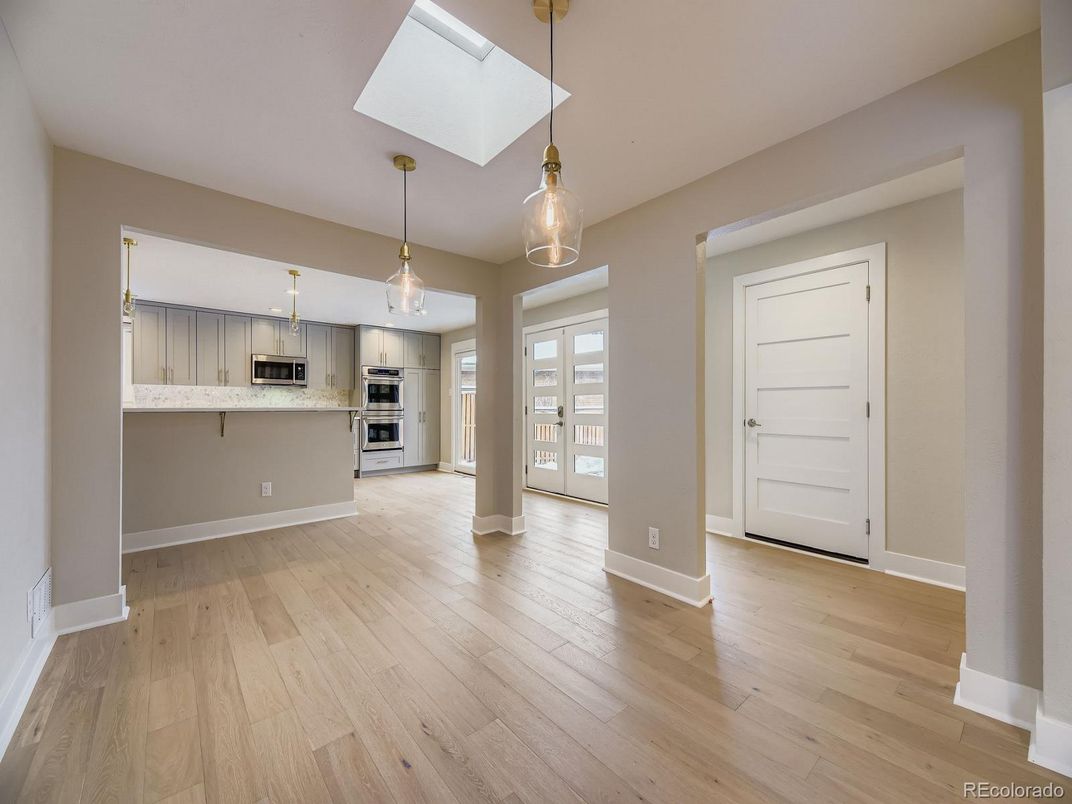 Empty room, Interior, Kitchen, Pendant Lights, Stainless Steel Appliances, Wood Texture Flooring