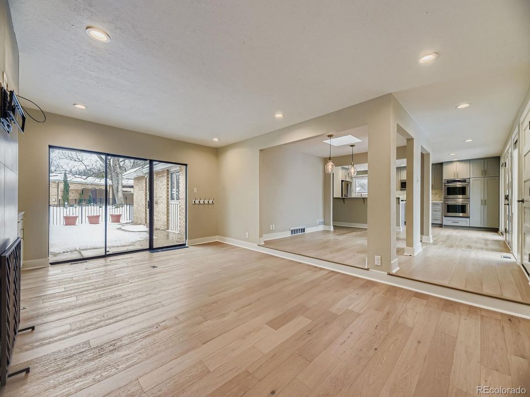 Empty room, Interior, Pendant Lights, Recessed Lighting, Stainless Steel Appliances, Wood Texture Flooring