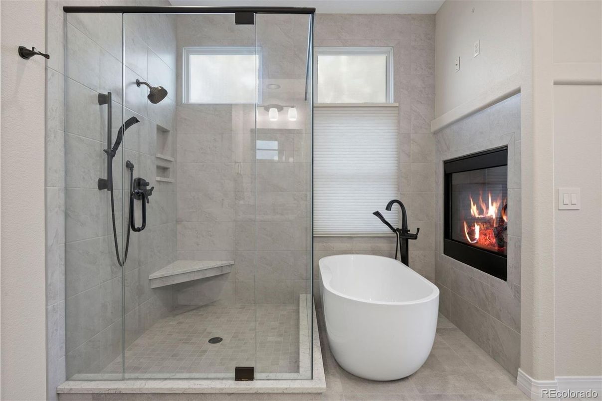 Bathroom, Fireplace, Free Standing Baths, Glass Shower, Interior, Marble Walls