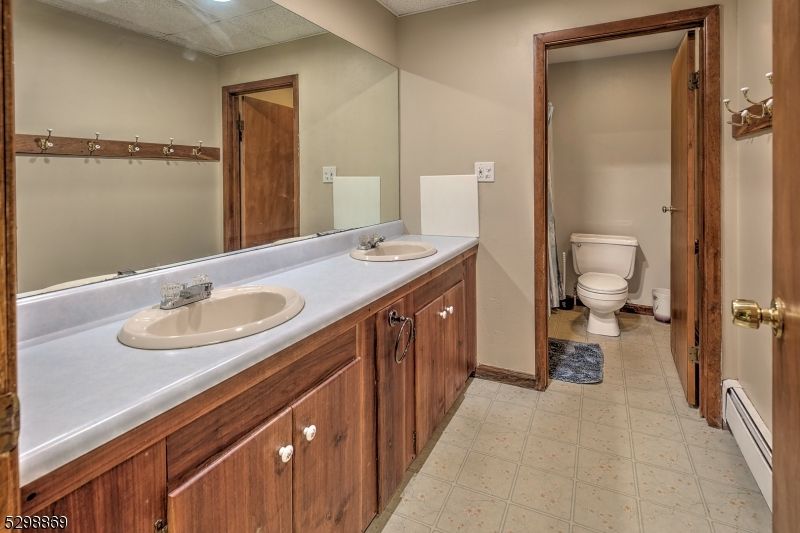 Bathroom, Dual Sink Vanities, Interior, Recessed Lighting, Tile Countertops