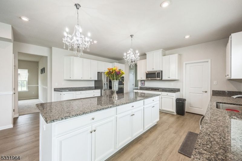 Chandelier, Interior, Kitchen, Pendant Lights, Recessed Lighting, Stainless Steel Appliances, Wood Texture Flooring